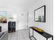 Bright foyer with tiled floors, modern decor, and ample natural light creating a welcoming atmosphere at 607 Bay Point Ave, Nokomis, FL 34275