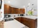 Bright kitchen boasts modern cabinets, stainless sink, ample counter space, and recessed lighting at 607 Bay Point Ave, Nokomis, FL 34275