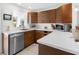 Well-lit kitchen features modern cabinets, stainless sink, appliances and ample counter space at 607 Bay Point Ave, Nokomis, FL 34275