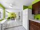 Bright eat-in kitchen area with modern cabinets, a view to the dining area, and tile floors at 607 Bay Point Ave, Nokomis, FL 34275