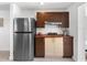 Compact kitchen equipped with modern appliances, sleek cabinets, and efficient layout at 607 Bay Point Ave, Nokomis, FL 34275
