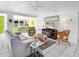 Bright living room featuring comfortable seating, stylish decor, and tile flooring at 607 Bay Point Ave, Nokomis, FL 34275