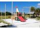 Bright and fun community playground with multiple play features and surrounding picnic area at 607 Bay Point Ave, Nokomis, FL 34275