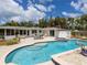 Stunning pool area and outdoor patio with inviting seating, perfect for relaxation and entertainment at 607 Bay Point Ave, Nokomis, FL 34275