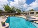 Beautiful pool and jacuzzi surrounded by a patio, with plenty of space for outdoor relaxation and entertaining at 607 Bay Point Ave, Nokomis, FL 34275