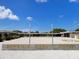 Nokomis Public Beach boasts expansive concrete, blue sky, and a decorative fountain at 607 Bay Point Ave, Nokomis, FL 34275
