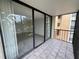 Balcony featuring sliding glass doors and tiled flooring with an outdoor view at 618 Bird Bay S Dr # 212, Venice, FL 34285