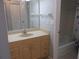 Bathroom with vanity, mirror, and tub and shower with curtain at 618 Bird Bay S Dr # 212, Venice, FL 34285
