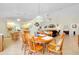 Open-concept dining area features an ornate hanging light fixture and tile flooring throughout at 6293 Taneytown St, North Port, FL 34291
