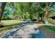 Picturesque driveway framed by mature trees, creating a grand entrance to the property at 6293 Taneytown St, North Port, FL 34291