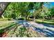 Long driveway leading to the wooded home, offering a peaceful retreat into nature at 6293 Taneytown St, North Port, FL 34291