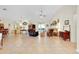 Bright open living area with tile floors connecting to kitchen and dining spaces at 6293 Taneytown St, North Port, FL 34291