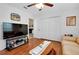 Living room with hardwood floors, television, and sofa at 6293 Taneytown St, North Port, FL 34291