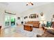 Bright living room with neutral walls, tile flooring, and French doors to the outdoors at 6293 Taneytown St, North Port, FL 34291