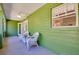 Screened porch with two chairs at 6293 Taneytown St, North Port, FL 34291