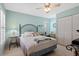 Inviting bedroom with a ceiling fan, neutral walls, and bright natural light at 657 Foxwood Blvd, Englewood, FL 34223