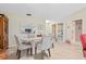 Bright dining area featuring a glass-top table, seating for four, and stylish decor at 657 Foxwood Blvd, Englewood, FL 34223