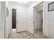 Bright entryway with patterned wallpaper, decorative rug, and access to multiple rooms at 657 Foxwood Blvd, Englewood, FL 34223