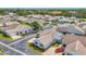 An aerial view of a cozy single-story home located in a charming neighborhood with tree-lined streets at 710 Ironwood Dr # 165, Venice, FL 34292