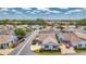 An aerial view of a single-story home located in a charming neighborhood with well-maintained streets at 710 Ironwood Dr # 165, Venice, FL 34292