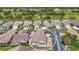 Aerial view of a home featuring a private backyard brick-paved patio and golf course in the distance at 710 Ironwood Dr # 165, Venice, FL 34292