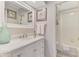 Bathroom with a vanity, sink, mirror, and walk-in shower at 710 Ironwood Dr # 165, Venice, FL 34292