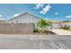 This is an exterior view of a cozy single-story home with an attached garage and a well maintained yard at 710 Ironwood Dr # 165, Venice, FL 34292