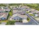This is an exterior view of a cozy single-story home with an attached garage and a well maintained yard at 710 Ironwood Dr # 165, Venice, FL 34292