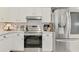 Modern kitchen with stainless steel appliances, white cabinets and plenty of counter space at 710 Ironwood Dr # 165, Venice, FL 34292