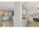 Open-concept living space with modern kitchen featuring stainless steel appliances at 710 Ironwood Dr # 165, Venice, FL 34292