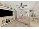 Comfortable living space featuring a sectional sofa, ceiling fan, and adjacent dining area at 710 Ironwood Dr # 165, Venice, FL 34292