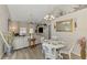 Inviting living room featuring vaulted ceilings, a cozy dining area, and stylish decor at 710 Ironwood Dr # 165, Venice, FL 34292