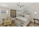 Serene main bedroom with soft lighting, a ceiling fan, and decorative accents at 710 Ironwood Dr # 165, Venice, FL 34292