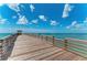 Long wooden pier extending over the ocean, perfect for leisurely strolls at 710 Ironwood Dr # 165, Venice, FL 34292
