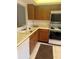 Functional kitchen with standard appliances, ample counter space, and a double basin sink at 744 Avenida Estancia # 144, Venice, FL 34292