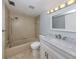 Bathroom featuring shower and tub combo, vanity and updated fixtures at 758 Village Cir # 106, Venice, FL 34292