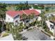 Beautiful condo with a red roof and palm trees at 758 Village Cir # 106, Venice, FL 34292