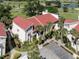 Beautiful condo with a red roof and palm trees at 758 Village Cir # 106, Venice, FL 34292