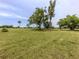 Sprawling golf course with mature trees and sunny skies at 758 Village Cir # 106, Venice, FL 34292
