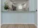 Kitchen pass-through featuring granite counters and a full view of appliances at 758 Village Cir # 106, Venice, FL 34292