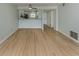 Open-concept living area with modern floors and a pass-through to the kitchen at 758 Village Cir # 106, Venice, FL 34292