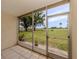 Enclosed patio with a view of the golf course at 758 Village Cir # 106, Venice, FL 34292