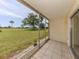 Enclosed patio with a view of the golf course at 758 Village Cir # 106, Venice, FL 34292