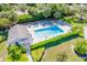 Aerial view of the community pool with ample seating and a well-maintained garden surround at 821 Waterside Dr # 205, Venice, FL 34285