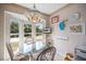 Cozy breakfast nook filled with natural light from large bay window at 821 Waterside Dr # 205, Venice, FL 34285