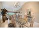 Open dining area adjacent to a relaxing living room with water views at 821 Waterside Dr # 205, Venice, FL 34285