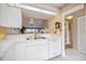Bright kitchen with stainless steel appliances, ample counter space, and bar top counter at 821 Waterside Dr # 205, Venice, FL 34285