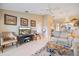 Inviting living room features tile flooring, neutral tones, and backyard views at 821 Waterside Dr # 205, Venice, FL 34285