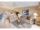 Inviting living room with view to dinette and vaulted ceilings at 821 Waterside Dr # 205, Venice, FL 34285