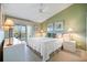 Charming main bedroom features tranquil water views, soft carpet, and two nightstands at 821 Waterside Dr # 205, Venice, FL 34285